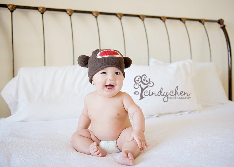 huntington beach lifestyle photographer baby with a monkey hat