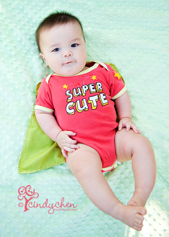 cute onesie with cape on an adorable baby boy!