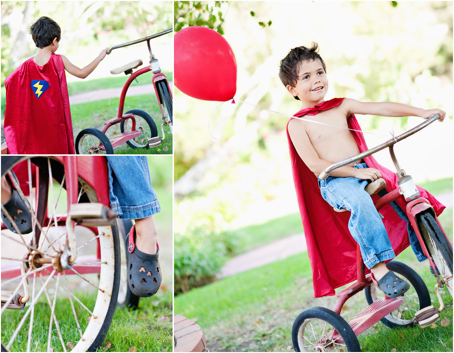 fun photos of a little boy playing superman riding a tricycle