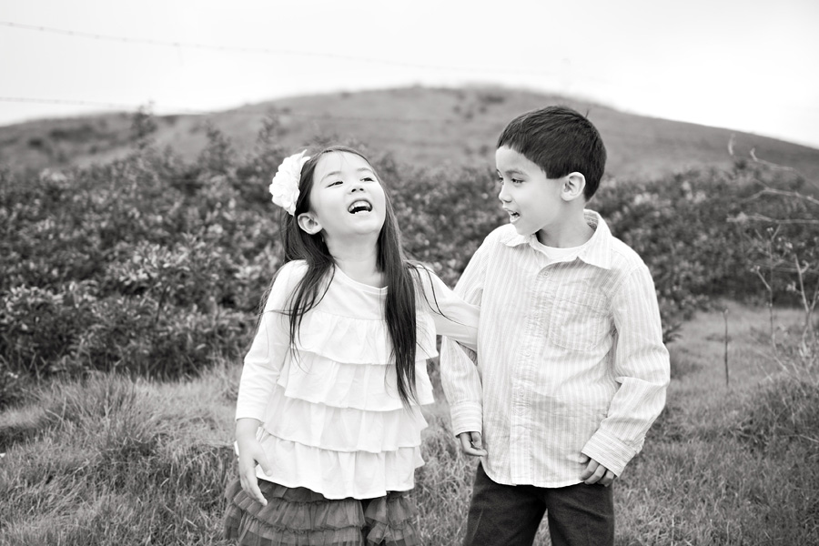 brother and sister laughing